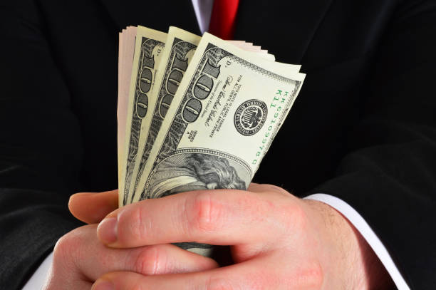 istock Businessman Holding Dollars 844148950