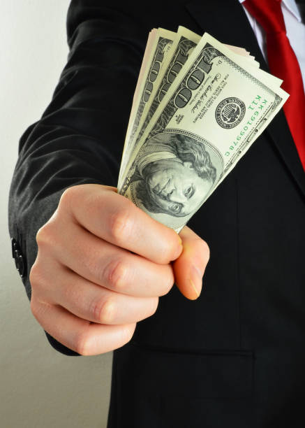 istock Businessman Holding Dollars 844149164