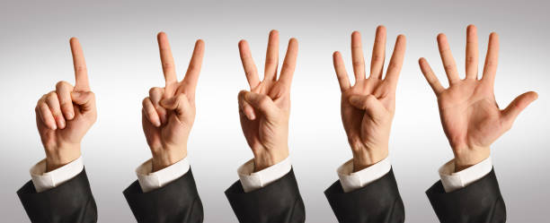 hands counting - number 1 businessman one finger one person imagens e fotografias de stock