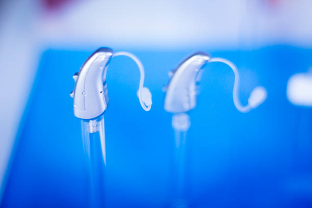 Modern high technology digital hearing aids in retail store shop window for the deaf and hard of hearing.