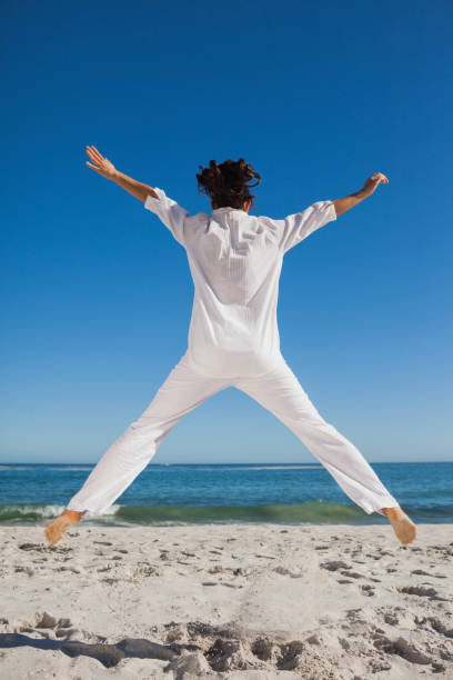 istock Woman jumping back to camera 844164920