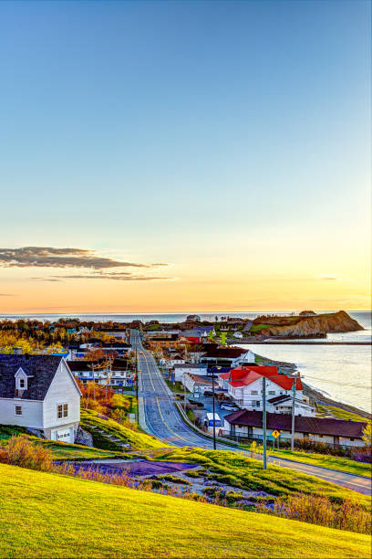 Perce, Gaspe Peninsula, Quebec, Canada, Gaspesie region with cityscape during sunrise Perce, Gaspe Peninsula, Quebec, Canada, Gaspesie region with cityscape during sunrise gaspe peninsula stock pictures, royalty-free photos & images