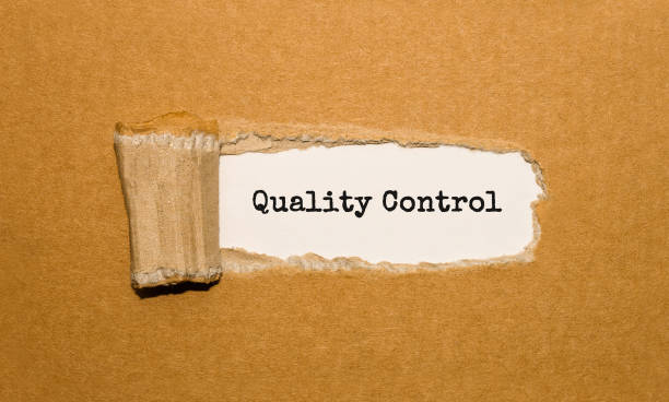 istock The text Quality Control appearing behind torn brown paper 844168026