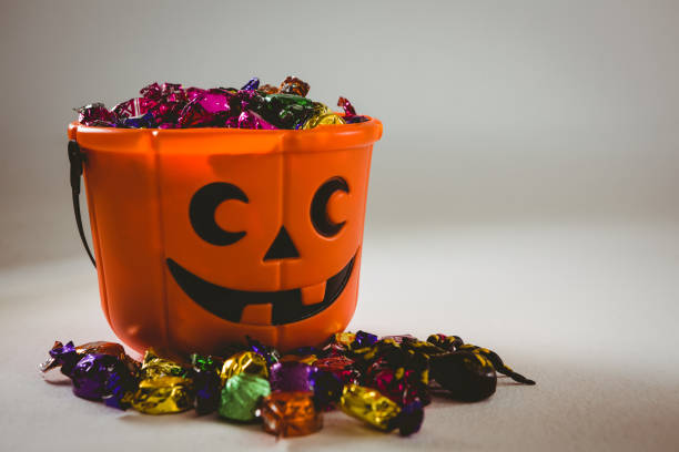 istock Bucket with wrapped chocolates during Halloween 844168082