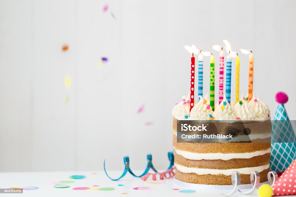 Birthday cake Birthday cake with colorful candles at a birthday party Birthday Cake Stock Photo