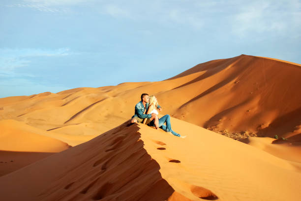 istock Loving couple in the Sahara Desert 844175636