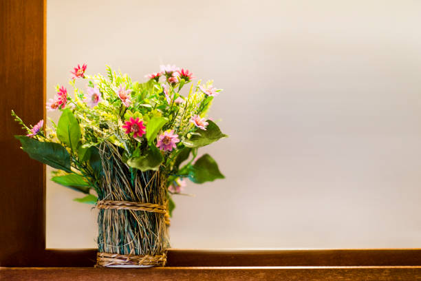 Weigela blooming beautiful wood vase on the table