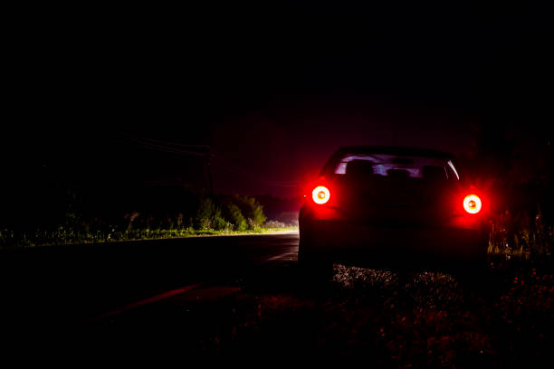istock Car parked on the road late at night 844179768