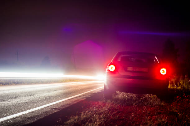 istock Car parked on the road late at night 844180046
