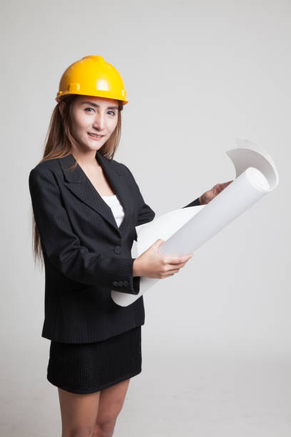 istock Asian engineer woman with blueprints. 844183688