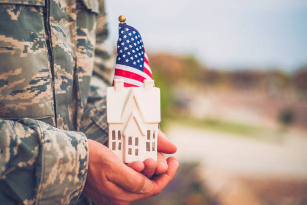 istock American military soldier with house. Relocation theme 844190360