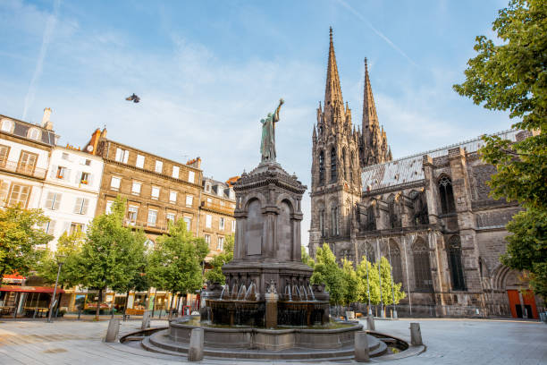 Morning view on the Victory square with monument and cathedral in Clermont-Ferrand city in France