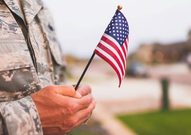 American military soldier with flag. Patriotic theme American military soldier with flag. Patriotic theme military lifestyle stock pictures, royalty-free photos & images