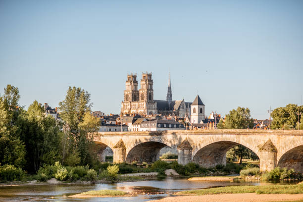 Orleans city in France Landscape view on the river and old arch bridge in Orleans city during the sunset in France loire atlantique photos stock pictures, royalty-free photos & images