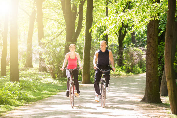 istock Young Couple Riding Bicycles 844197630