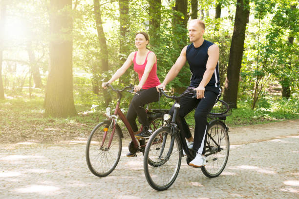istock Young Couple Riding Bicycles 844197644