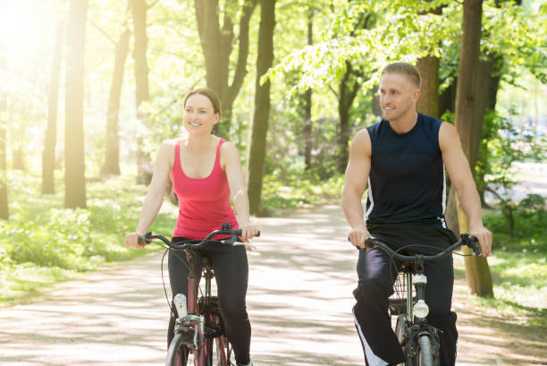 istock Young Couple Riding Bicycles 844197688