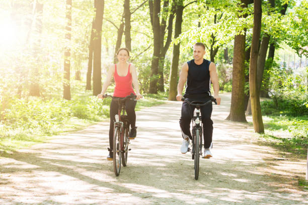 istock Young Couple Riding Bicycles 844197724