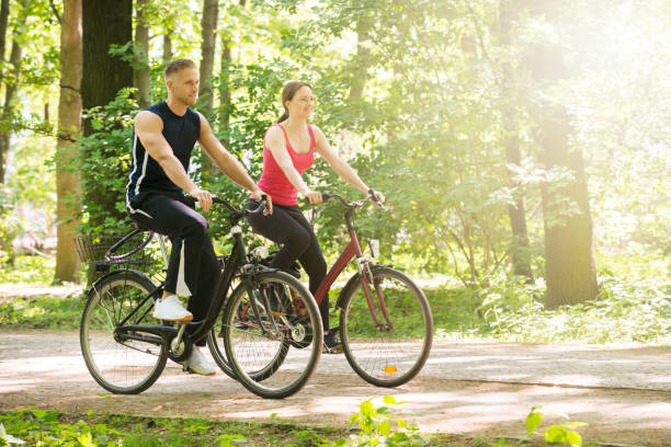 istock Young Couple Riding Bicycles 844197784