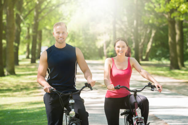 istock Happy Couple Standing With Bicycles 844197854