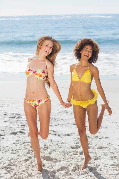 istock Happy women having fun on the beach 844198760