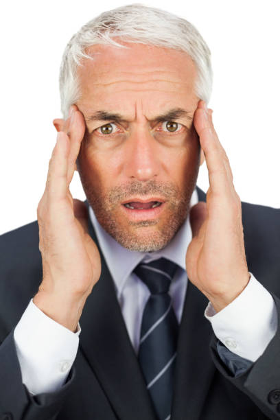 istock Surprised businessman looking at camera holding his temples 844202220