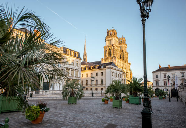 Orleans city in France Sunset view on the old town with saint Croix cathedral in Orleans city in France orleans france photos stock pictures, royalty-free photos & images