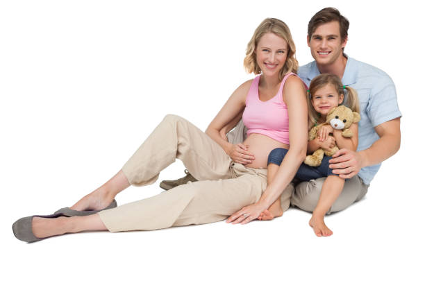 istock Happy young family expecting a new arrival smiling at camera 844205396