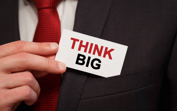 istock Businessman putting a card with text Think BIG in the pocket 844205978
