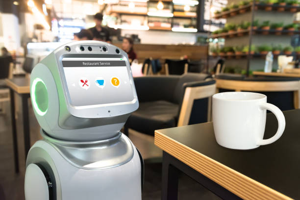 istock Robotics Trends technology business concept. Autonomous personal assistant personal service robot for order menu food in restaurant and cup of coffee. 844208772