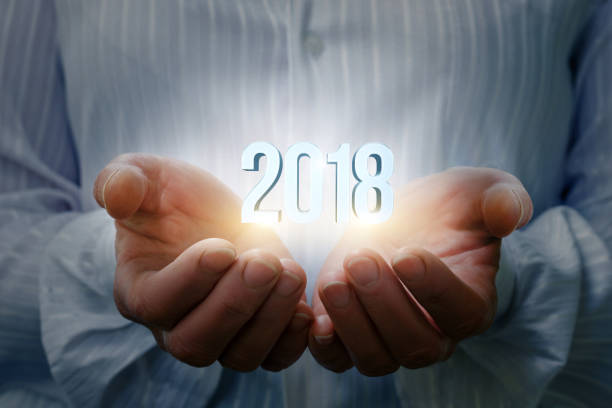 istock Businesswoman showing 2018 in hand . 844209162