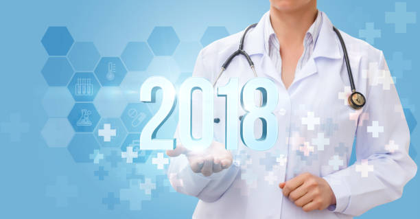 istock Doctor shows the numbers 2018 . 844209164