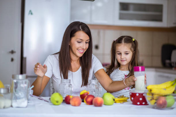 istock Mother and daughter baking together 844209214