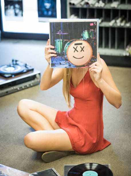 istock Young pleasant woman playing records 844209398