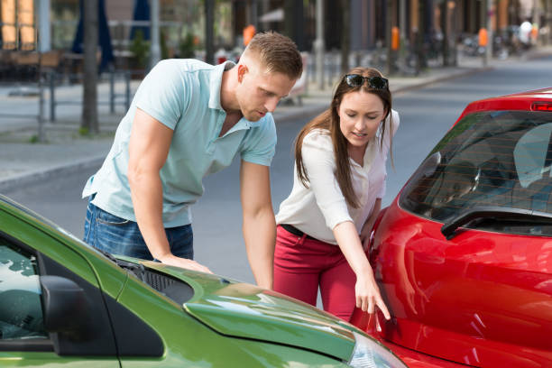 istock Woman Showing Man Car Collision 844209620