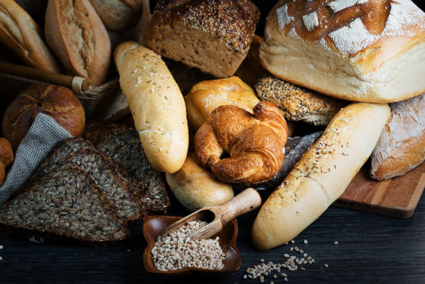 istock Different bread and bread slices, food background. 844212288