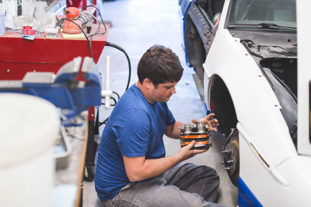 istock Mechanic works on car in his home garage 844213360