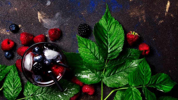 istock Alcoholic cocktail with vodka, juice, berry and ice 844213860