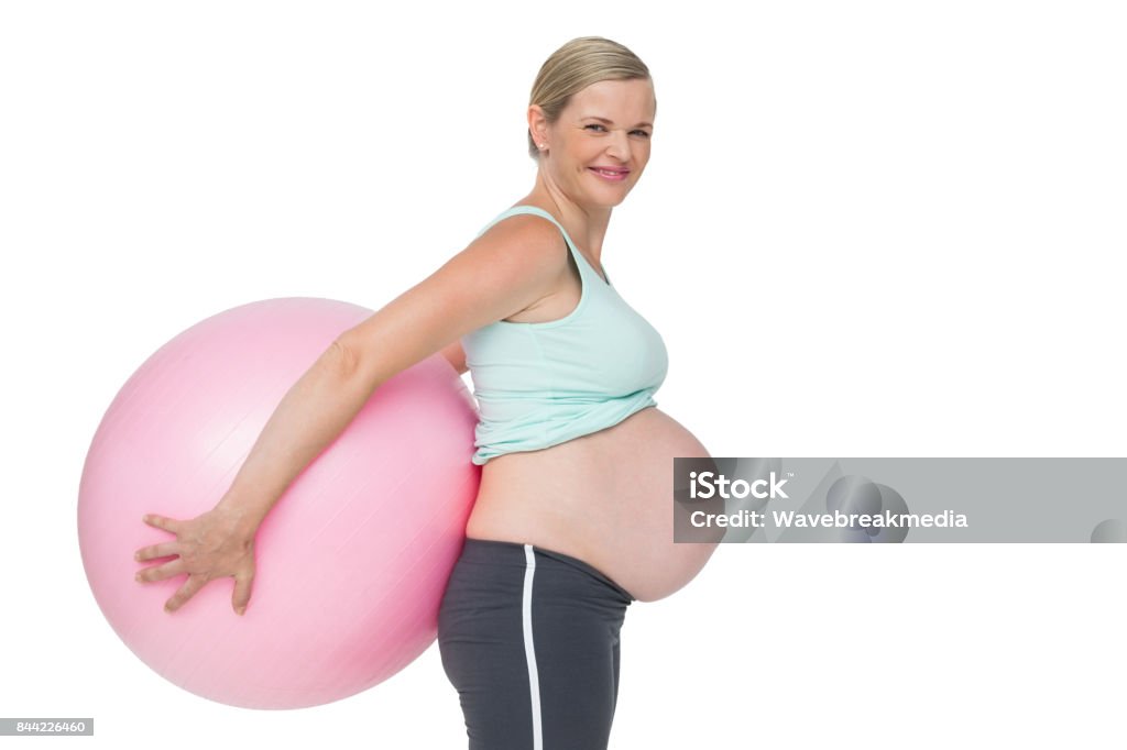 Schwangere Frau mit rosa Gymnastikball hinter ihrem Rücken - Lizenzfrei 35-39 Jahre Stock-Foto