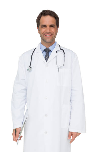 istock Happy doctor smiling at camera holding clipboard 844226680