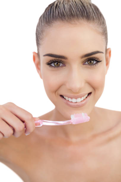 istock Smiling woman holding a toothbrush 844229898