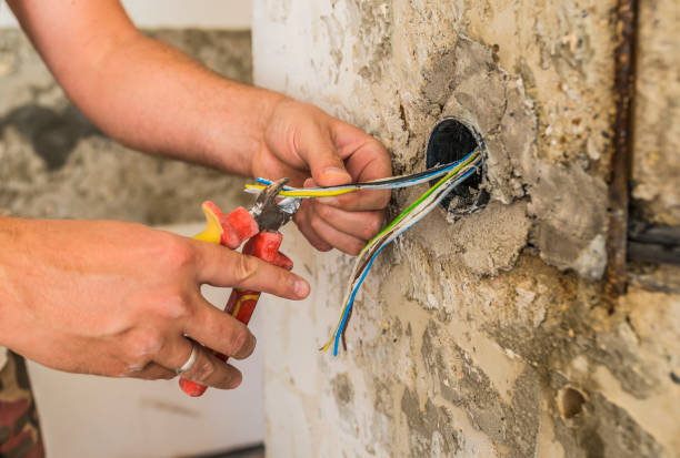 istock Hands striping the insulation of wires with cutter 844232716