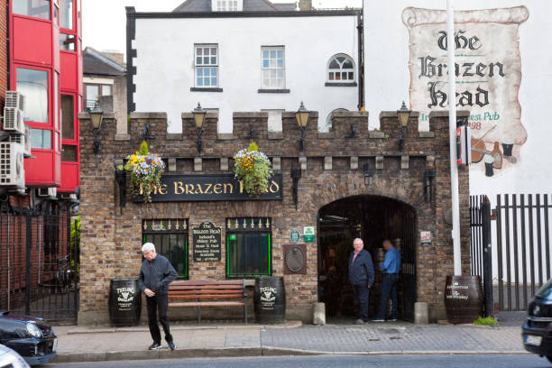 Dublin, Ireland - May 22, 2016. People entering and exiting The Brazen Head pub in downtown Dublin the capital of Ireland. The Brazen Head is billed as Irelands oldest pub and records go back to 1198.