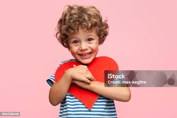 Charming Boy Posing With Heart Stock Photo - Download Image Now - Child, Happiness, Heart Shape