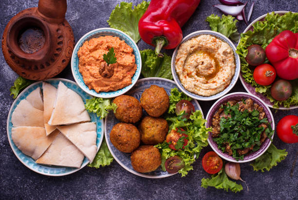 Selection of Middle eastern or Arabic dishes. Selection of Middle eastern or Arabic dishes. Falafel, hummus, pita and  muhammara. Top view middle eastern food photos stock pictures, royalty-free photos & images
