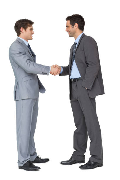 istock Happy business partners shaking hands 844243098