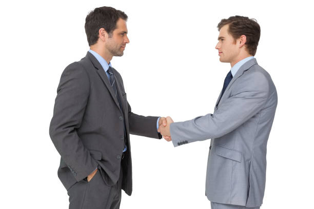 istock Smiling business team shaking hands 844244430
