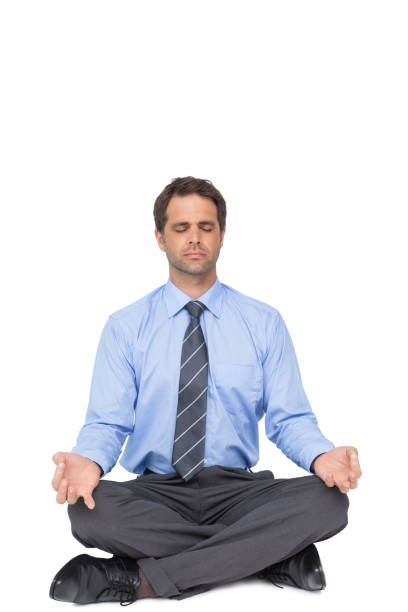 istock Zen businessman meditating in lotus pose 844245164