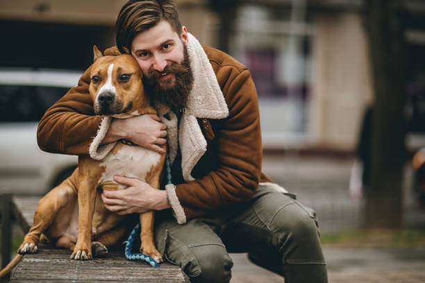 istock Attractive hipster man with his cute dog 844245488