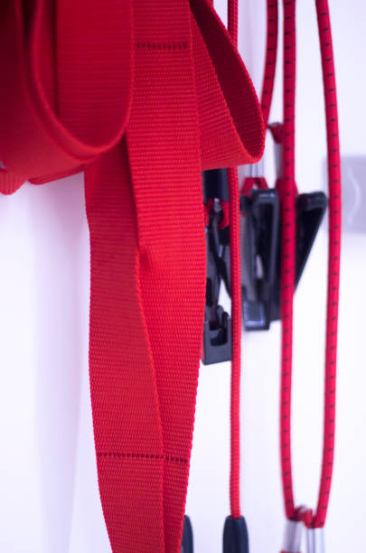 istock Suspension training physical therapy exercise equipment with red cord gravity bodyweight resistance workout. 844245588
